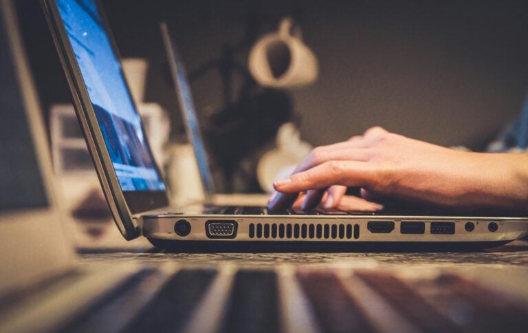 A photo of a man using a laptop