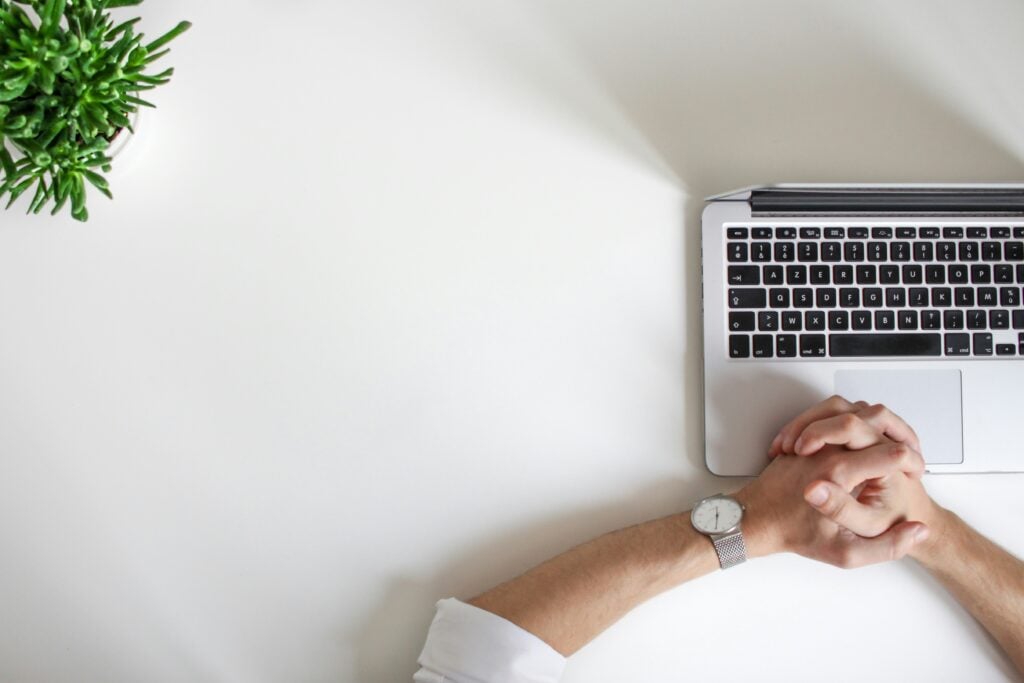 A man waiting patiently for his laptop to load