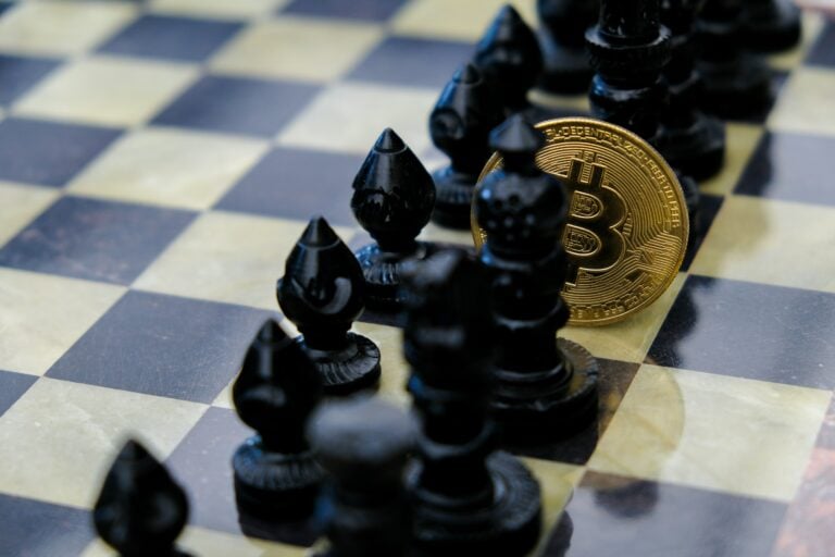 Bitcoin chess piece on a chessboard symbolizing strategic cryptocurrency trading